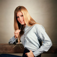 Portrait of a teenage girl chewing a piece of straw poster print
