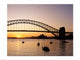 Sunrise over Sydney Harbor Bridge Poster Print showcasing vibrant colors and iconic architecture.