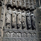 Notre Dame Cathedral Carving Poster Print featuring intricate facade details.