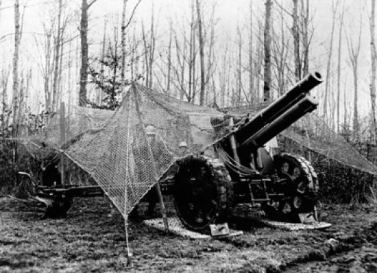 Poster print of two Swiss soldiers with medium-caliber artillery under netting.