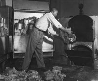 Art print of a man putting currency notes into an incinerator, symbolizing the fleeting nature of wealth.