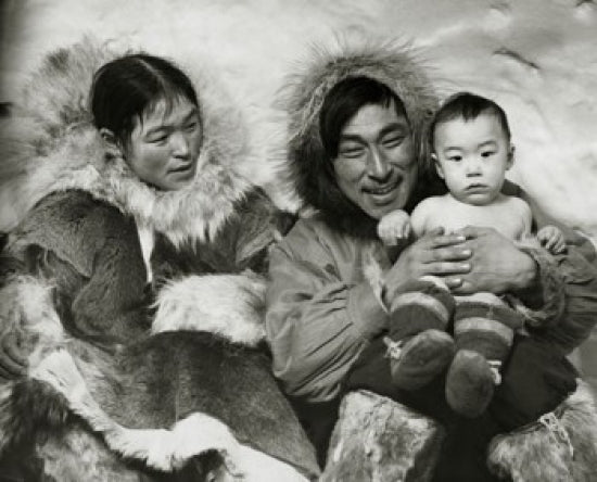 Eskimo couple sitting with their son poster print
