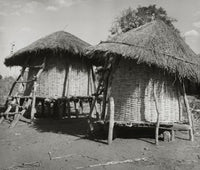 Grain storage bins in a field in Malawi poster print