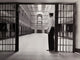 Side profile poster print of a prison guard, showcasing authority and strength.
