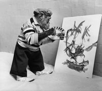 Chimpanzee holding a paintbrush and palette poster print