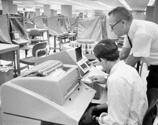Office worker demonstrating computer interrogation device poster print