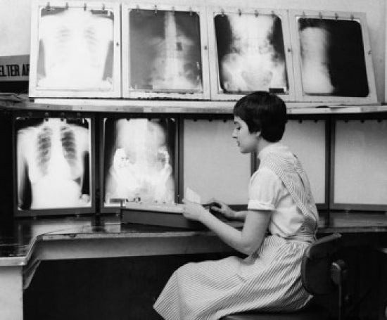 Female Nurse Working in a Doctor's Office Poster Print