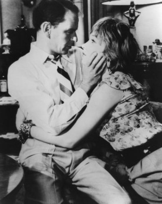 Young Couple Embracing Poster Print showcasing a romantic scene.