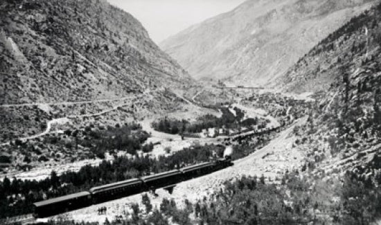 High angle view of a train moving on railroad tracks poster print.