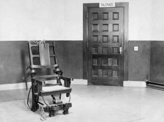 Electric Chair in an Empty Room Poster Print in various sizes.