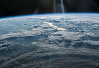 Sun Glint from the International Space Station Poster Print showcasing Earth's landscapes illuminated by sunlight.