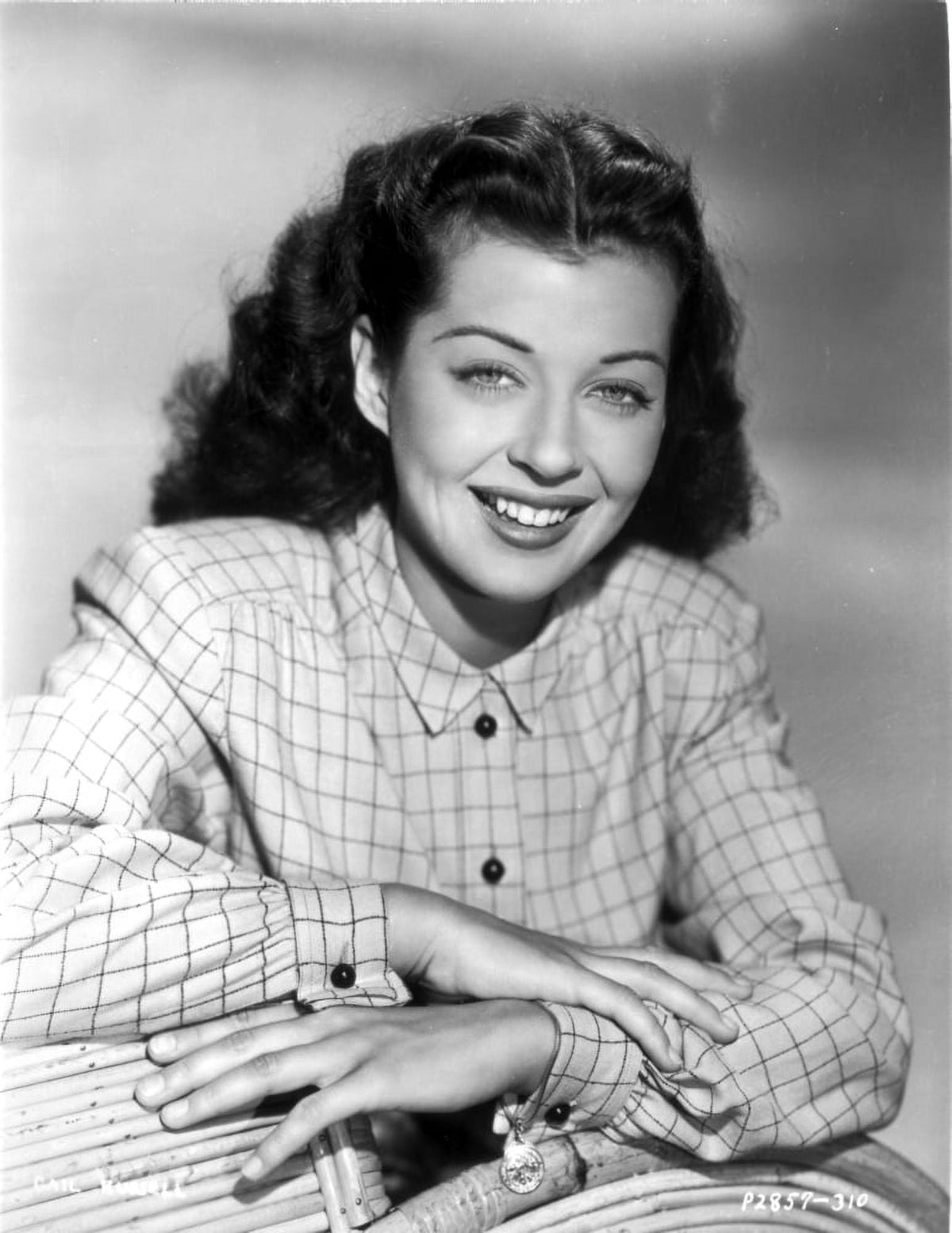 Gail Russell smiling in a checkered shirt photo print.