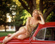 Christina Applegate On Car Photo Print in various sizes.
