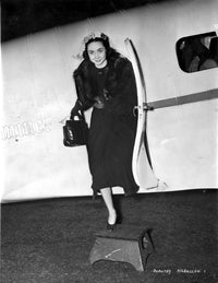 Vintage photo print of Dorothy Kilgallen wearing a long sleeve dress.
