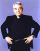 Tom Bosley posed in a black long sleeve polo photo print.