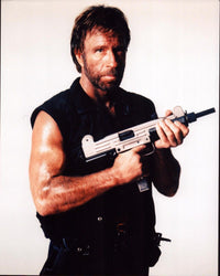 Chuck Norris holding a gun in Delta Force 2 photo print.