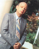 Wallace Shawn portrait photo print in gray striped coat.