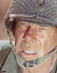 Close-up portrait photo print of Lee Marvin wearing a helmet.