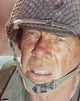 Close-up portrait photo print of Lee Marvin wearing a helmet.