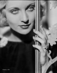 Carole Lombard wearing a black blouse photo print, vintage style.