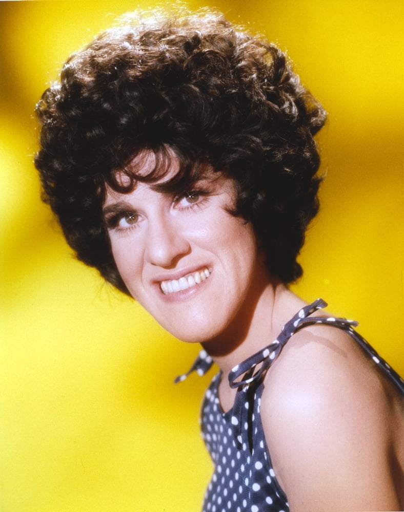 Ruth Buzzi smiling portrait photo print with yellow background.