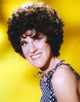 Ruth Buzzi smiling portrait photo print with yellow background.