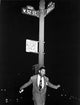 Dizzy Gillespie photo print featuring the jazz legend by a signpost.