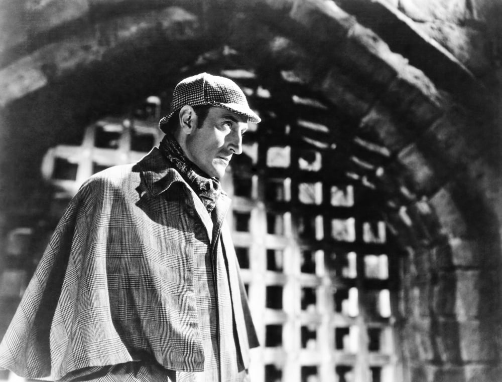 The Adventures of Sherlock Holmes movie poster featuring Basil Rathbone, 1939.