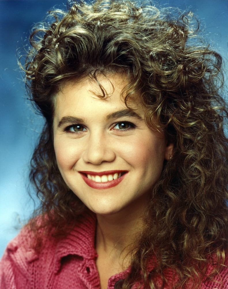Tracey Gold posing in a red top photo print