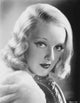 Bette Davis portrait photo print in white fur coat and black underclothes.