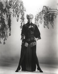 Janet Leigh in corset holding a pistol photo print.