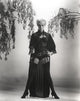 Janet Leigh in corset holding a pistol photo print.