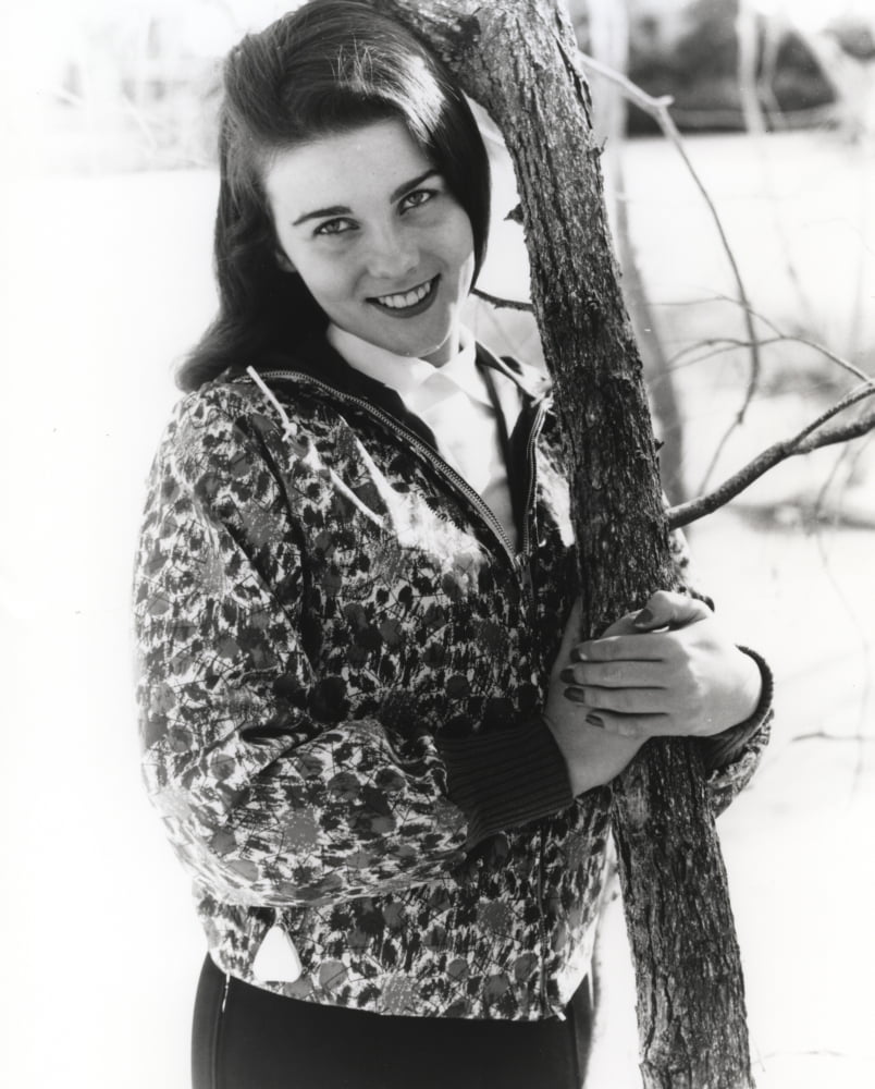 Ann-Margaret hugging a tree photo print showcasing her love for nature.