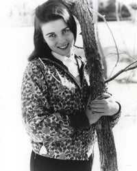 Ann-Margaret hugging a tree photo print showcasing her love for nature.