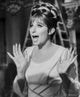 Barbra Streisand looking amazed in a white dress photo print