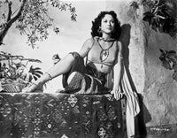 Hedy Lamarr wearing a costume sitting outdoors photo print