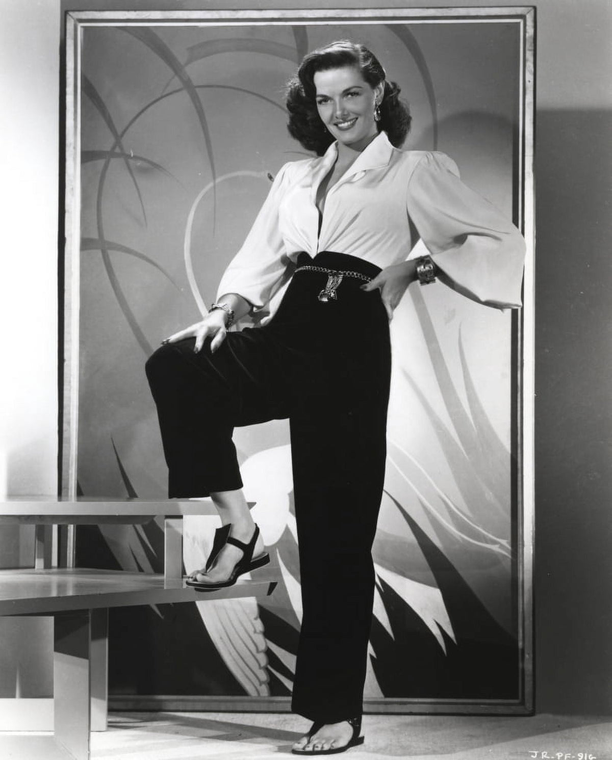 Jane Russell elegant photo print in white long sleeve shirt and linen pants.
