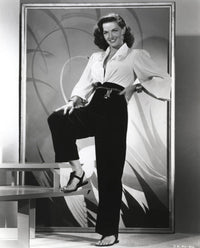 Jane Russell elegant photo print in white long sleeve shirt and linen pants.