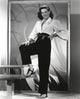 Jane Russell elegant photo print in white long sleeve shirt and linen pants.