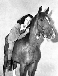 Classic portrait photo print of Elizabeth Taylor riding a horse.