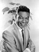 Nat King Cole smiling photo print showcasing his charm and charisma.