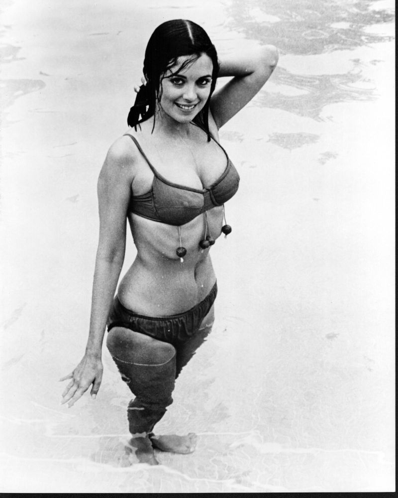 Black and white photo print of Phyllis Davis in a bikini by the pool.