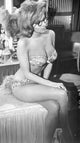 Black and white photo print of Nancy Kovack in bikini and glasses.
