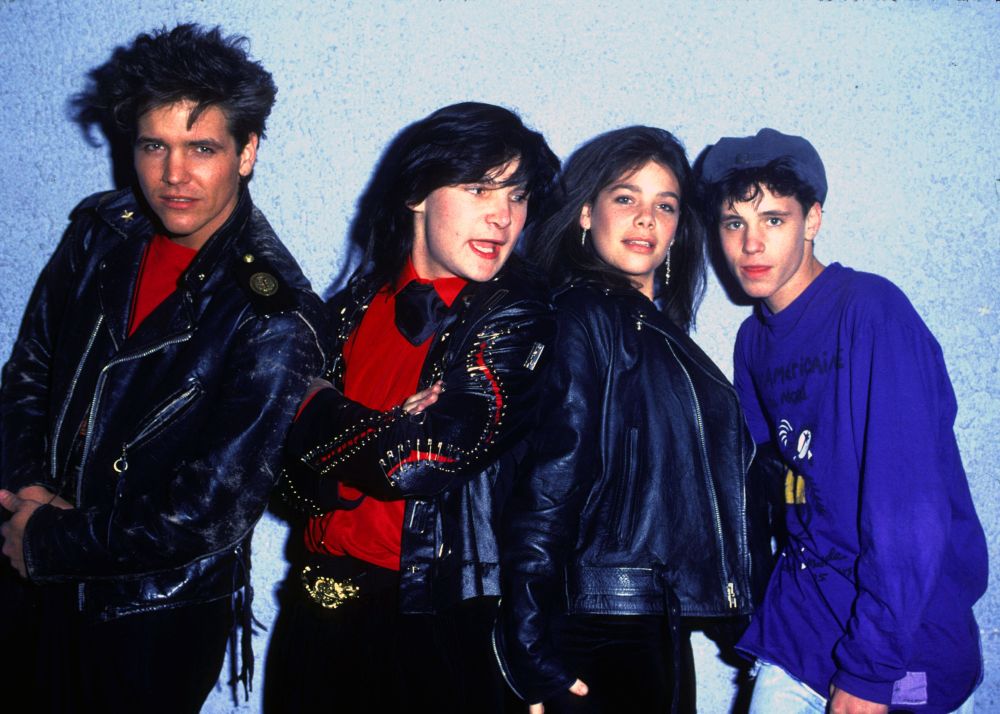 Behind-the-scenes photo from 'Rock On' featuring Michael Damian, Corey Feldman, Meredith Salenger, and Corey Haim