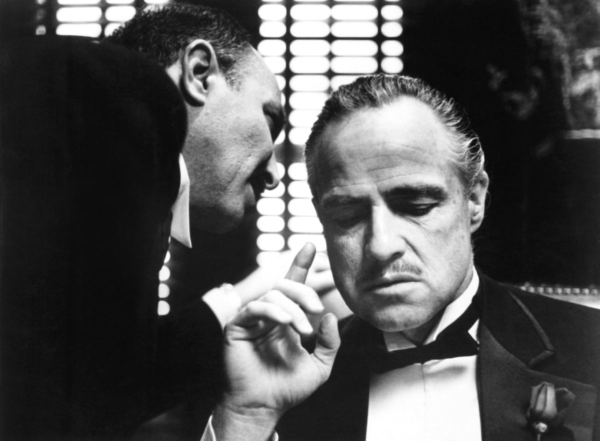 The Godfather Movie Poster Print Collection featuring iconic film stills.