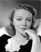 Virginia Bruce smiling with pearl necklace photo print