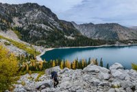 Backpacker starting ascent up Asgard Pass in Alpine Lakes Wilderness, Washington State.