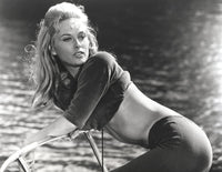 Classic photo print of Faye Dunaway bending over, available in multiple sizes.