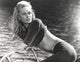 Classic photo print of Faye Dunaway bending over, available in multiple sizes.