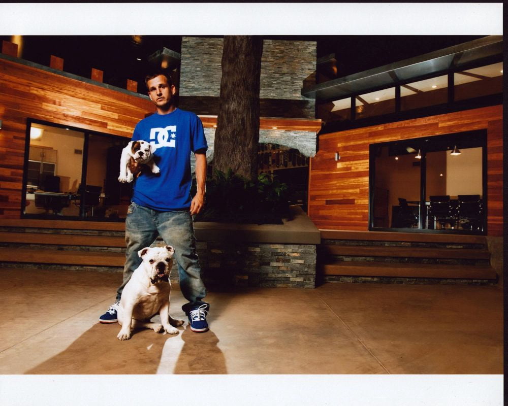 Rob Dyrdek at home with dogs photo print, showcasing a warm and charming moment.